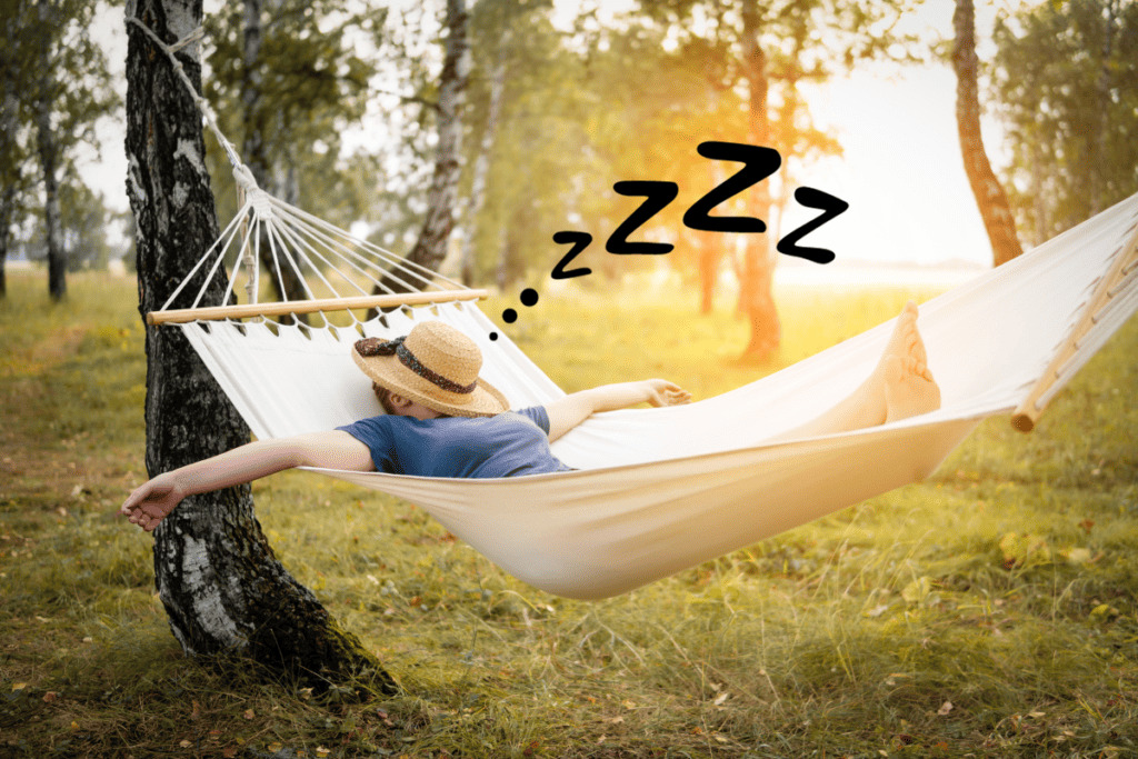 Woman sleeping in a hammock